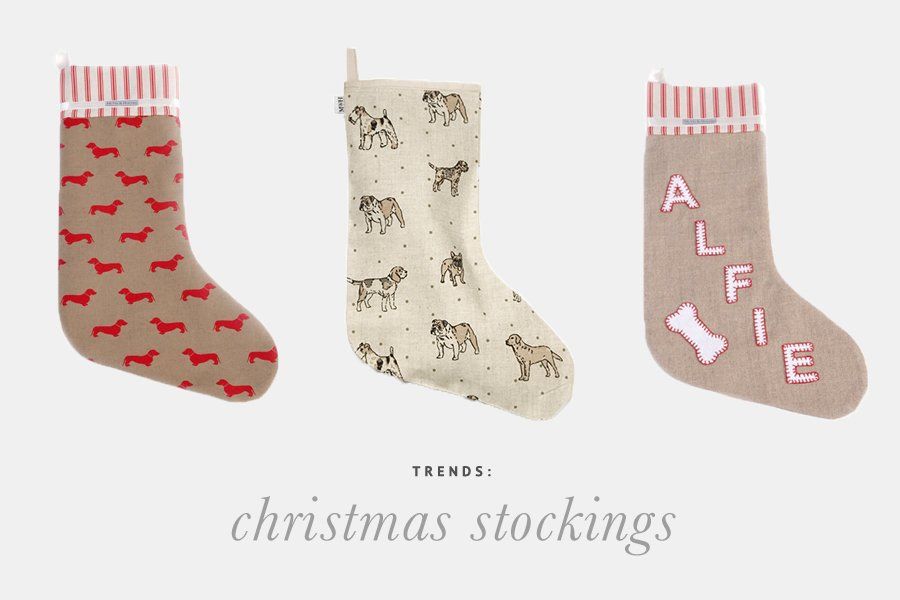 Three dog Christmas stockings featuring a dachshund pattern, various dog illustrations, and a personalized Alfie design.