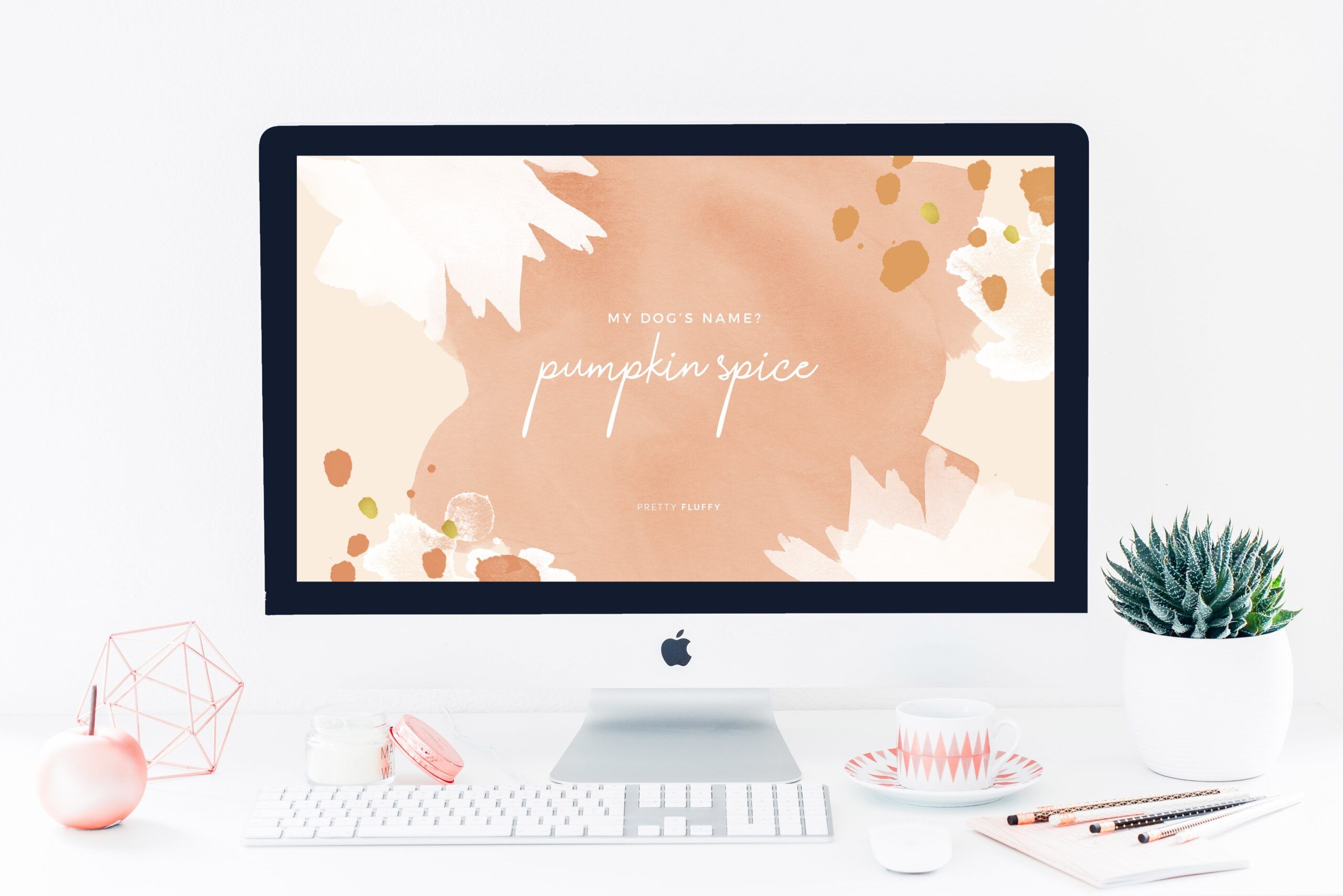 'My Dog's Name? Pumpkin Spice' fall dog quote screensaver on a desktop computer in an aesthetic home office.