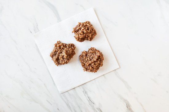 Three homemade healthy banana dog cookies resting on a white napkin.