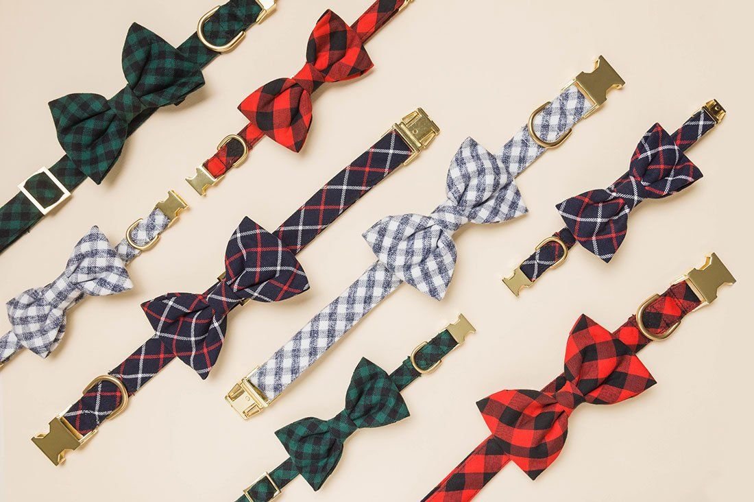 Festive plaid dog collars and bow ties from The Foggy Dog holiday collection in red, green and navy with gold hardware.