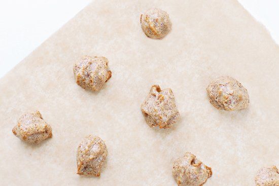 Bite-sized homemade grain-free dog treats on parchment paper