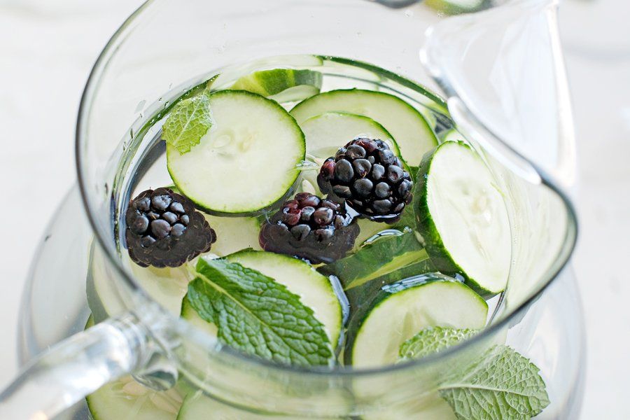 Healthy cucumber, blackberry, and mint infused water, a refreshing hydration treat for dog wellbeing.
